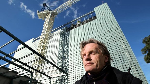 Sean Godsell with the Design Hub building under construction behind him.