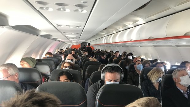 Most passengers wore masks, but cabin crew did not.