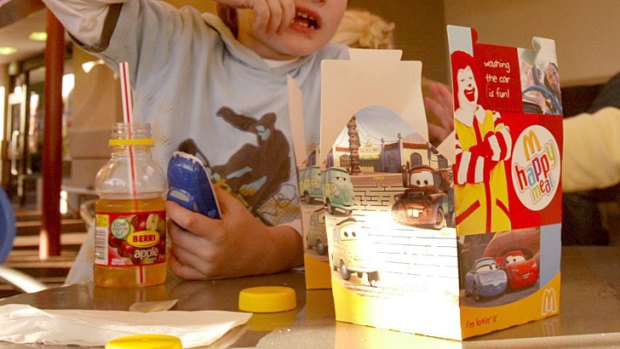 Instead of toys ... Happy Meals in the US will come with books published by McDonald's.