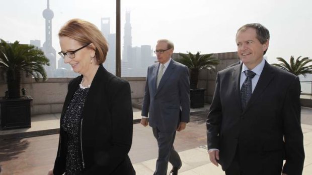 Prime Minister Julia Gillard with ministers Senator Bob Carr and Bill Shorten in China. The government has called Coalition senator Barnaby Joyce's comments on trade with China 'reckless'.