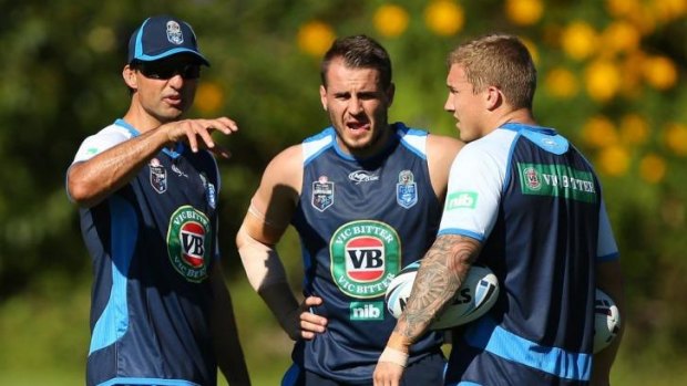 Laurie Daley talks to Josh Reynolds and Trent Hodkinson on Saturday.