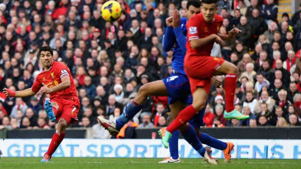 On target: Luis Suarez of Liverpool terrorises Cardiff City's goal.
