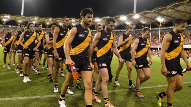 Richmond players return to the rooms after losing to the Suns.