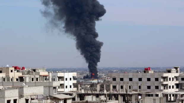 Smoke billows from the site of reported airstrike by pro-regime planes in the eastern Ghouta suburb of Damascus.