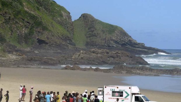 Another death...paramedics attempt to save the latest Second beach shark victim last Sunday.