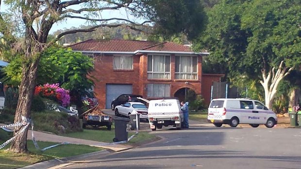 Police work at one of the crime scenes in Carina Heights.