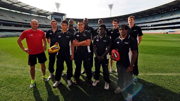 Select group: AFL ambassador Tadgh Kennelly (left) with international prospects.