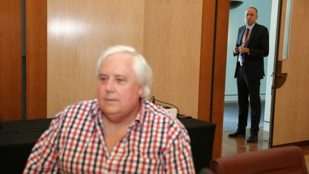 The man behind: Ben Oquist with Clive Palmer.