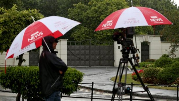 A BBC crew stand in front of the gates of the Charters Estate in Sunningdale, Berkshire, where British entertainer Cliff Richard has an apartment.