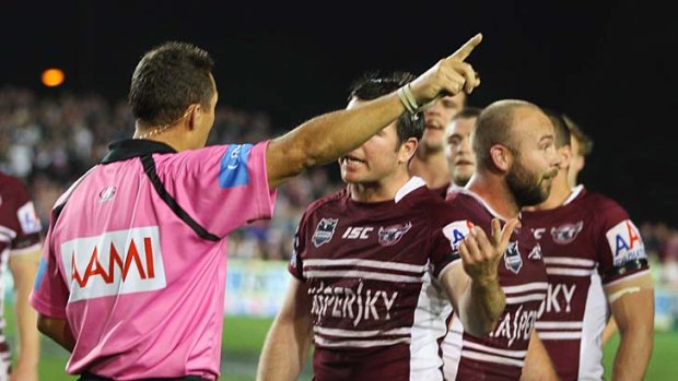 Referee Shayne Hayne sends Glenn Stewart of the Sea Eagles off for 10 minutes for fighting during the match against the Melbourne Storm.