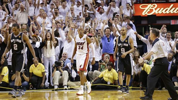 And the crowd goes wild: Heat fans celebrate Ray Allen's three-pointer.