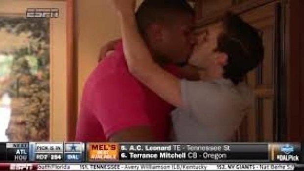 Michael Sam and his boyfriend share a celebratory kiss.