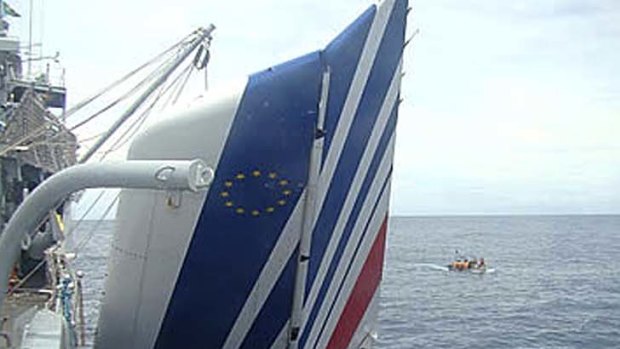 A Brazilian Navy ship picks debris from Air France 447 out of the Atlantic Ocean.