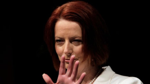 Look who's back ... Prime Minister Julia Gillard fronts the media in Adelaide this morning.