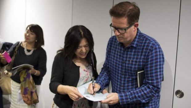 Big in Japan: Matthew Bourne signs autographs outside Tokyo's Orb Theatre.