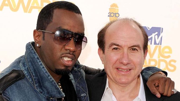 Huge salary ... Philippe Dauman, right, pictured here with Sean "P. Diddy" Combs, was paid $80 million in just nine months.