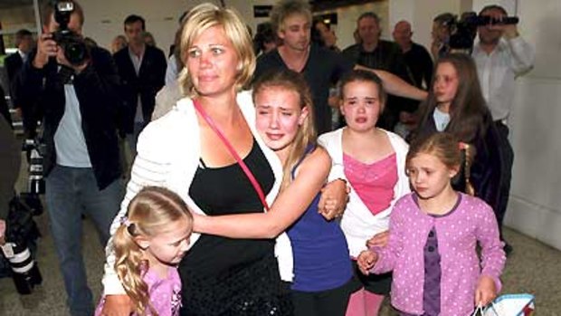 Annice Smoel is reunited with her daughters at Melbourne Airport.