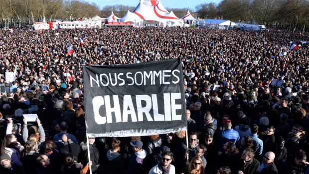 People hold a banner reading in French "We are Charlie" during a march in Bordeax, south-western France. 