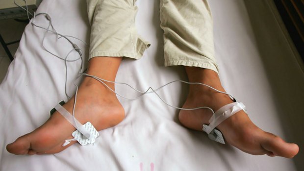 A 2005 file photo showing a 12-year-old boy receiving electric shock treatment for his internet addiction at the Beijing Military Region Central Hospital.