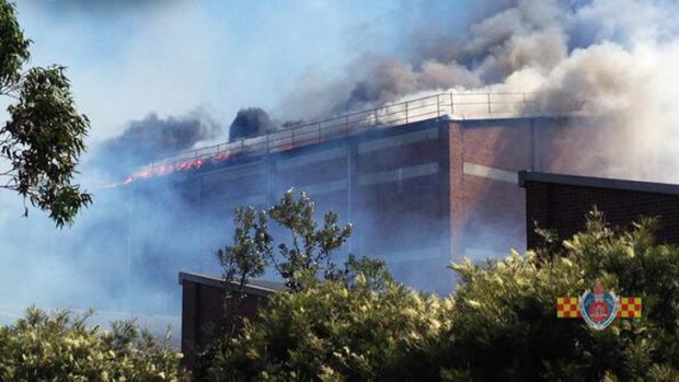 Smoke billows from the paper mill at Matraville.