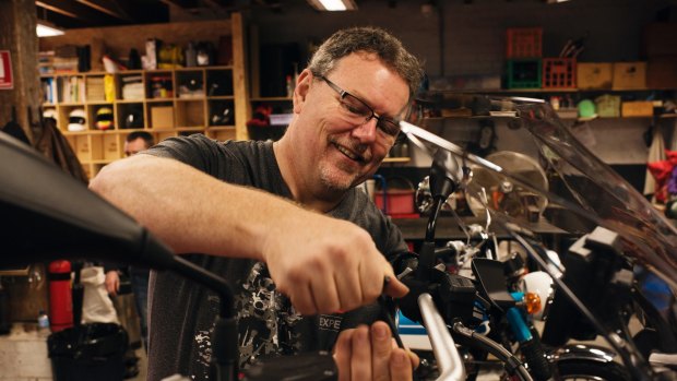 Rising Sun Workshop - Newtown. Sydney's first communal motorcycle workshop that provides space, tools, storage and expert advice for members to work on their motorcycles. Peter Whitfield working on his BMW GS 2017. 
