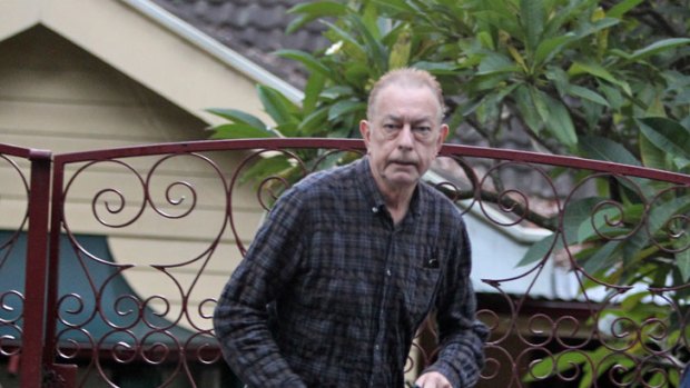 Businessman John Gilleland at his Palm Beach home this morning during a police raid.