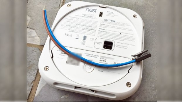 The rear of the Nest Protect: while the smoke alarm is double-insulated to reduce the risk of shock, the supplied power cable is not. This means to meet Australian safety standards the Nest should be installed with a junction box in the ceiling (not included in the box) which covers the supplied power cable – including where it connects to the mains power and to the Nest. You should also turn off the power at the switchboard before removing the Nest from the ceiling to replace the batteries.