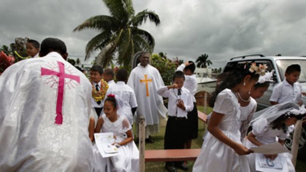 The role of religion... children at their first Communion at the Holy Eucharist Church in Suva.