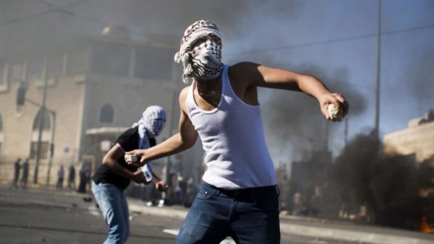 Palestinian youths clash with Israeli police near the house of murdered Palestinian teenager Mohammad Abu Khieder.
