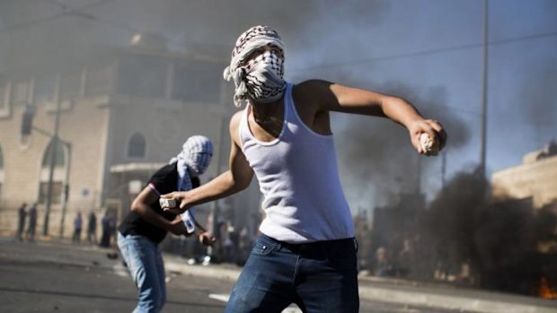 Palestinian youths clash with Israeli police near the house of murdered Palestinian teenager Mohammad Abu Khieder.