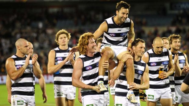Along for the ride: Geelong star Jimmy Bartel is carried from the field by teammates after playing his 200th game against Adelaide yesterday.