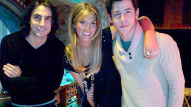 Working relationship ... Greg Garbowsky, Delta Goodrem and Nick Jonas in the studio.