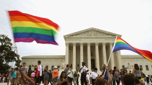 Supporters of marriage equality gather in front of the US Supreme Court, which ruled on Friday that same-sex couples have the right to marry in all states.