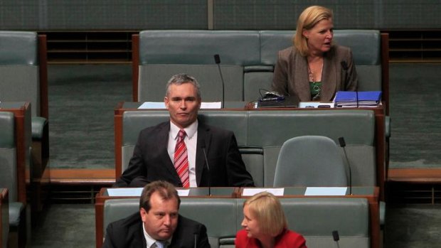 Craig Thomson, centre, during question time today.