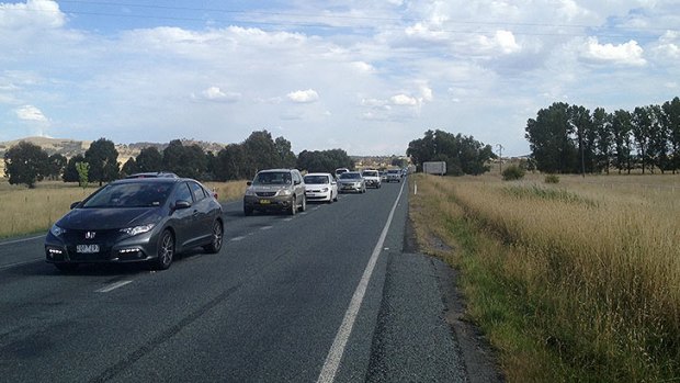 Traffic on Barton Highway has banked up for several kilometres leading up to the crash.