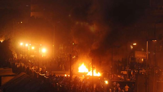 Smoke billows from burning cars as clashes erupted between Egyptian Coptic Christians and security forces in Cairo.