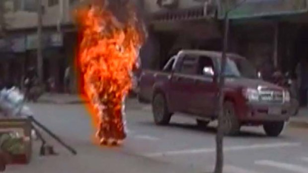 Footage obtained by Students for a Free Tibet purports to show a 35-year-old woman in nun's robes standing on a street corner engulfed in flames.