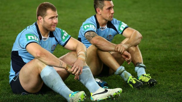 Ups and downs: Roosters halfback Mitchell Pearce suffers the sting of defeat after NSW lost the decider.