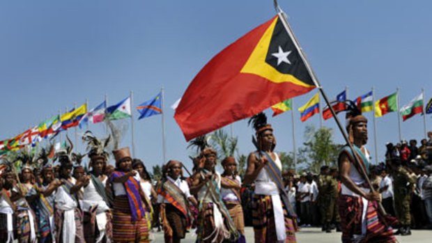 Celebrations . . . Traditional East Timorese tribal warriors take part in the official procession to mark the country's 10th anniversary of independence.