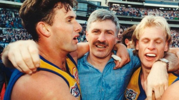 Brett Heady, Mick Malthouse and Dean Kemp embrace after West Coast's 1994 premiership win.