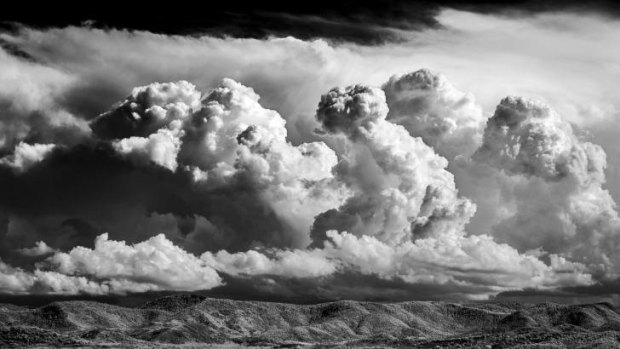 From <i>brindabellas</i>: storms passing behind Tuggeranong, from Scrivener Hill.