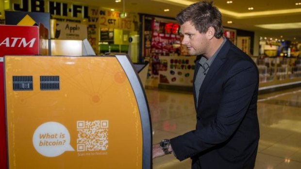 Australian Bitcoin ATMs director Robert Masters uses Canberra's first Two-Way Bitcoin ATM at the Canberra Centre.
