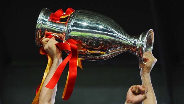 Champions ...  Iker Casillas lifts the trophy.