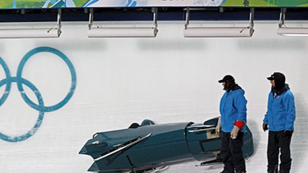 The Australian bobsleigh team of Duncan Harvey and Christopher Spring crashes during training run at Whistler.