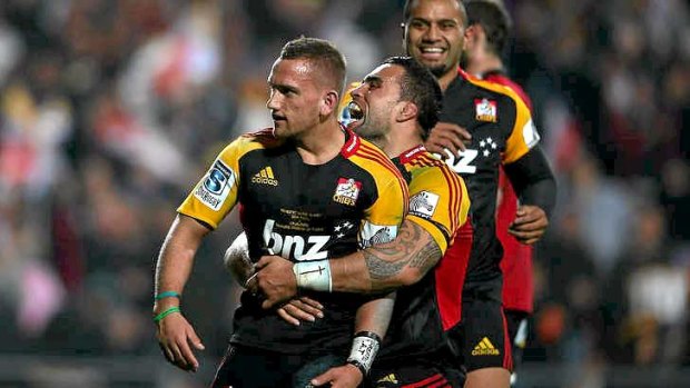 Aaron Cruden of the Chiefs celebrates with Liam Messam after scoring a try.