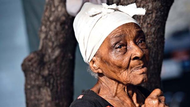 Elderly among the most vulnerable ... Idamise Pierre sits beneath a tree at the Azil communal home for the aged in Port-au-Prince.