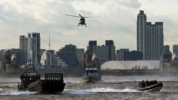 British police and Royal Marines speed along the Thames in London as part of a security planning exercise in January in preparation for the Olympics.