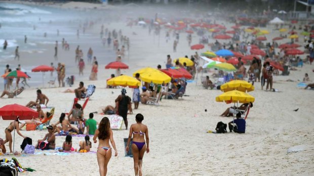 People at Ipanema beach in Rio de Janeiro as the temperatures soar to mark the beginning of summer.