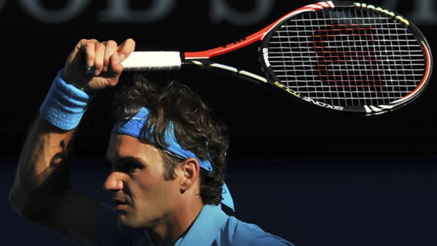Roger Federer comes out of the shadows on Rod Laver  Arena.