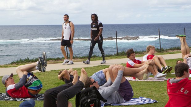 We will fight them on the beaches ... Lote Tuqiri of the Wests Tigers was a keen onlooker at the Swans' recovery session at Coogee yesterday following the side's defeat of St Kilda on Sunday.